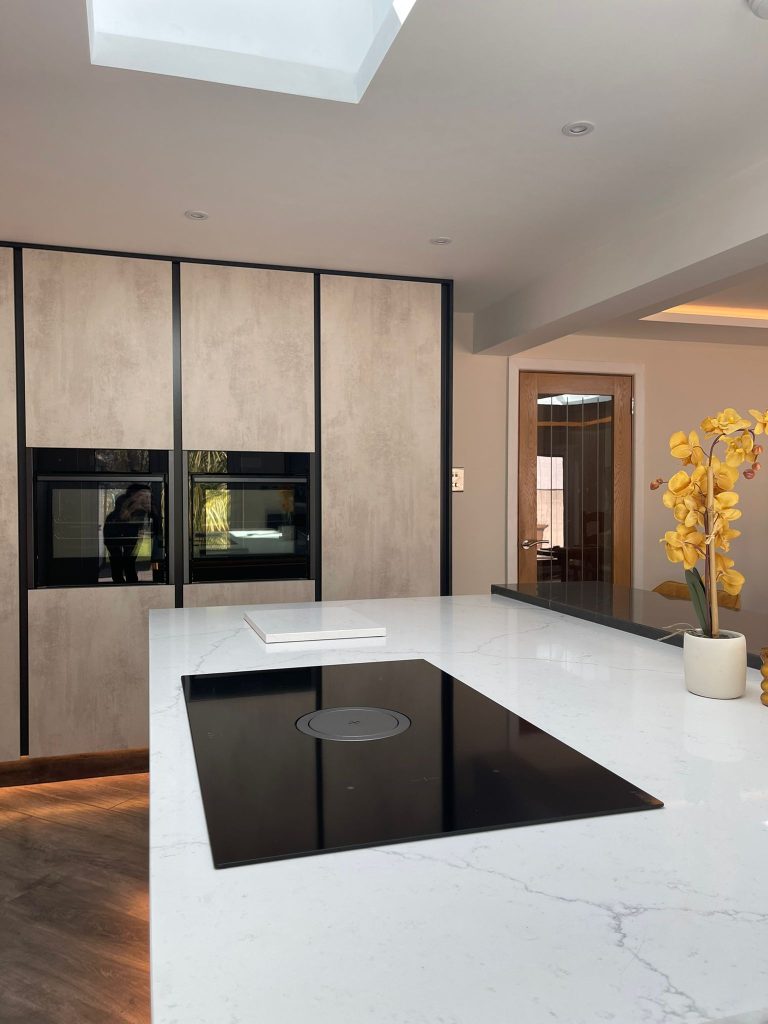 The Midwinter's open plan kitchen featuring Linea White Chromix and Silver Metal Slate doors