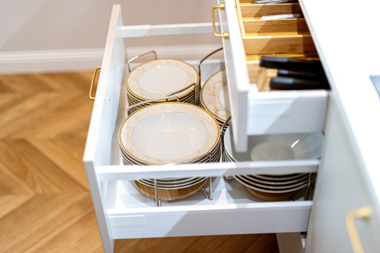 Declutter Your Kitchen drawers with plates and cutlery