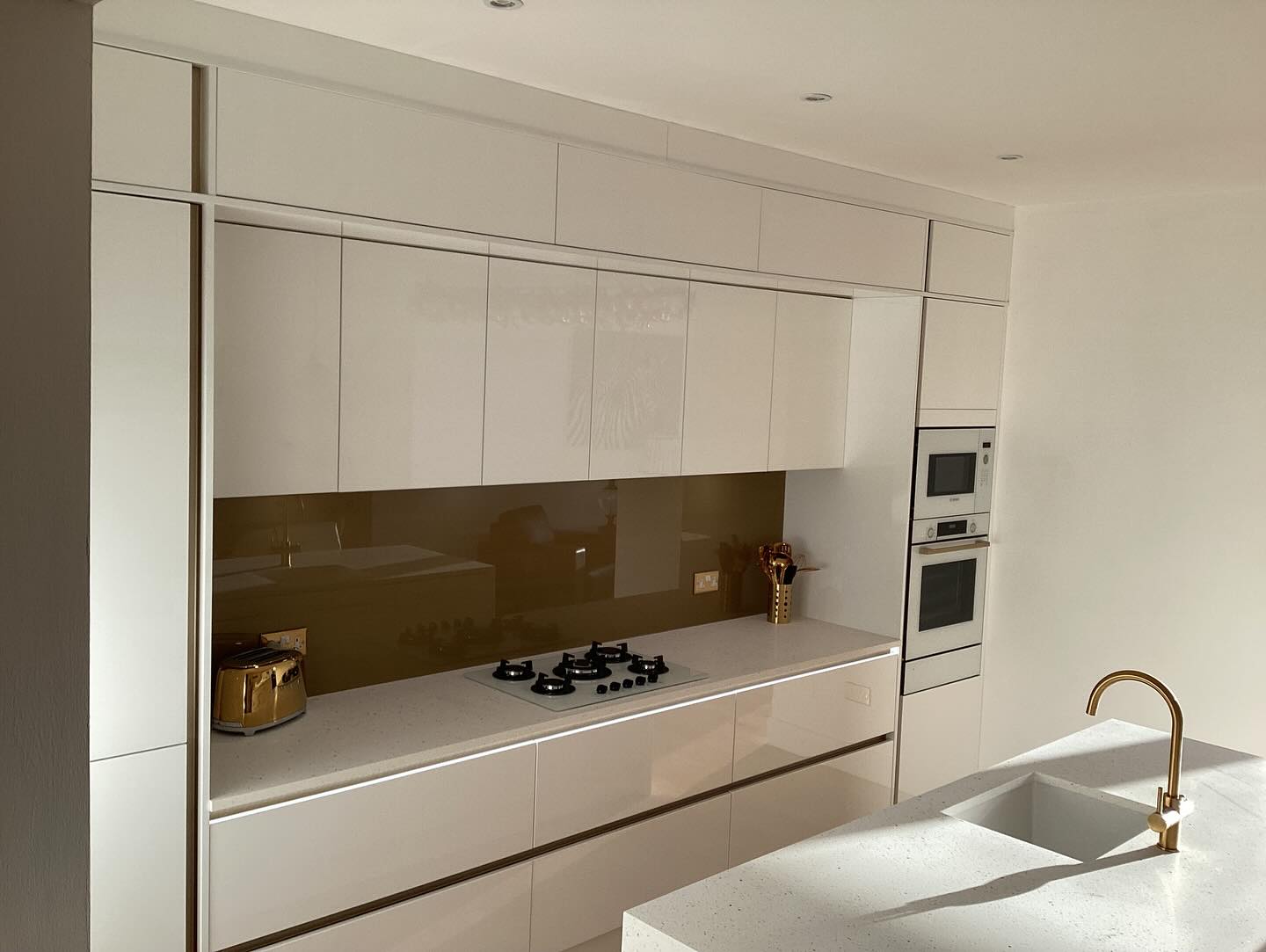 Zara Gloss White kitchen renovation completed by The Kitchen Depot in 2024