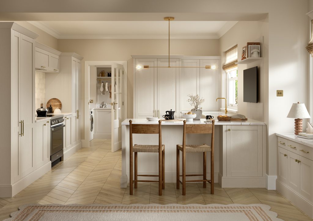 Kitchen with Nola door in Taupe Grey by The Kitchen Depot, featuring an island with bar stools, light cabinetry, and gold accents.